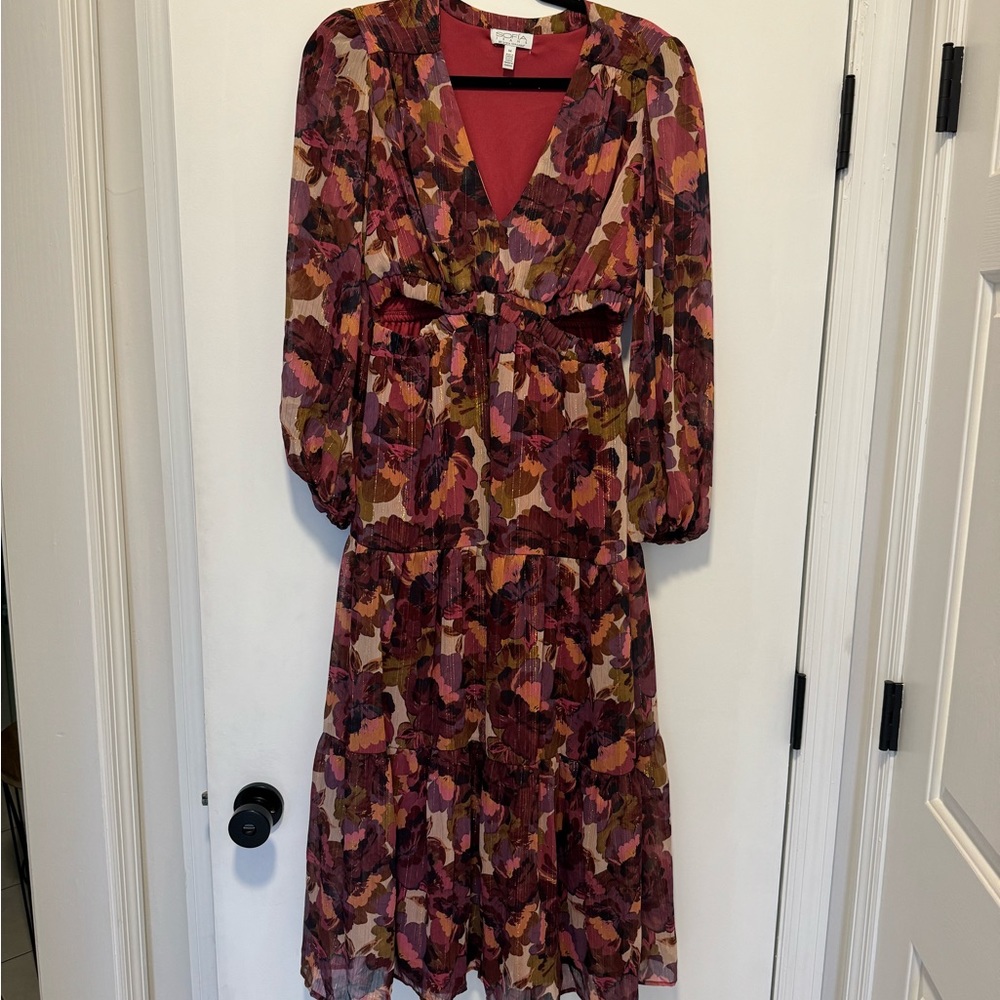 Beautiful multi floral low cut midi dress with cut out waist and shimmery lines.